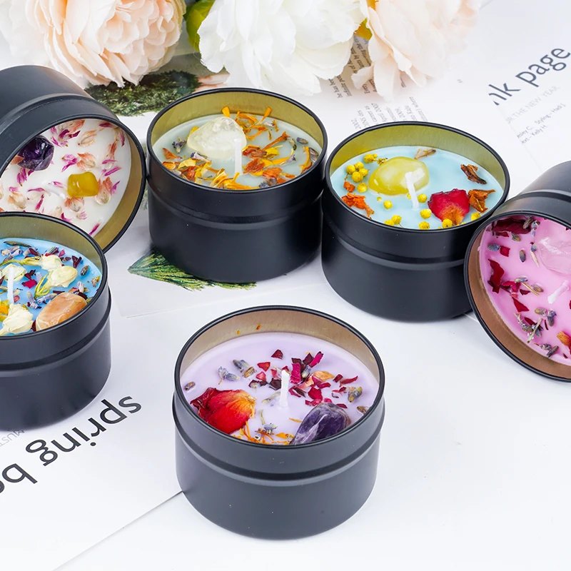 Dried flower and crystal soy wax candles in black tin jar