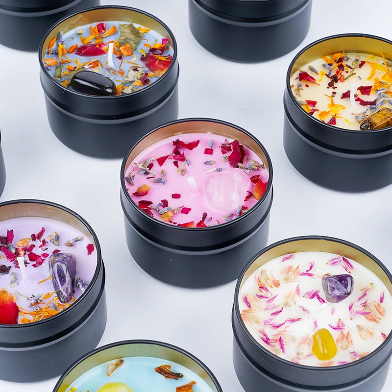 Dried flower and crystal soy wax candles in black tin jar